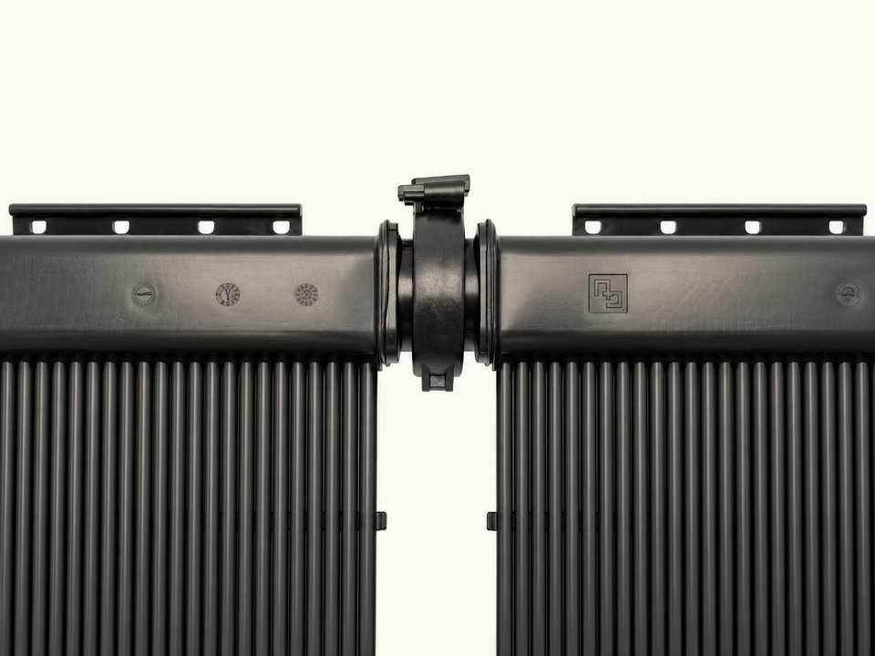 Two SwimJoy panel headers joined end to end by the panel clamp, with no hose between them