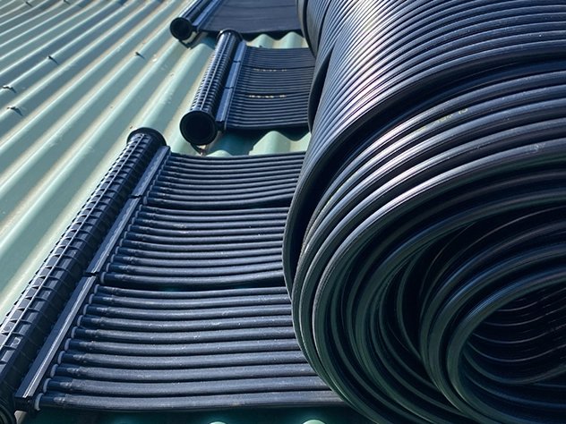 A NanoEdge panel rolled out on a metal roof