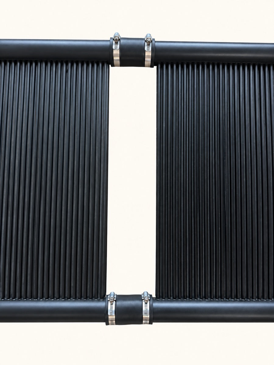 Two SwimEasy panels joined at the headers by rubber hoses and stainless hose clamps