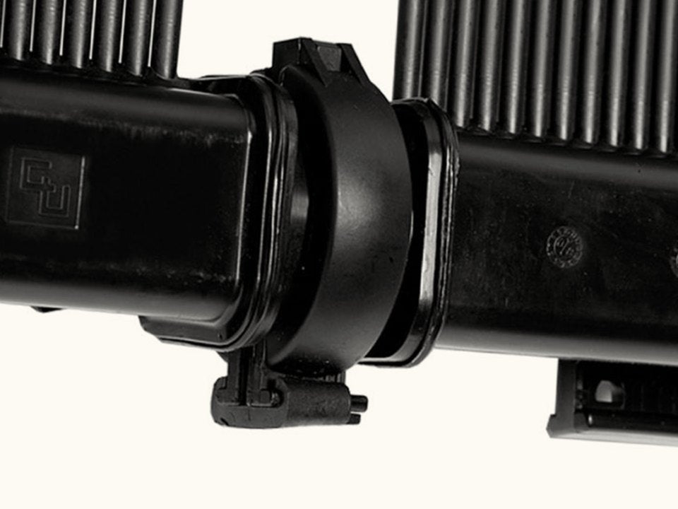 Two SwimJoy panel headers joined end to end by the panel clamp, with no hose between them