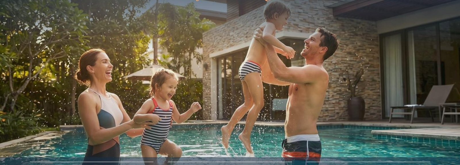 Family playing together in a warm backyard pool