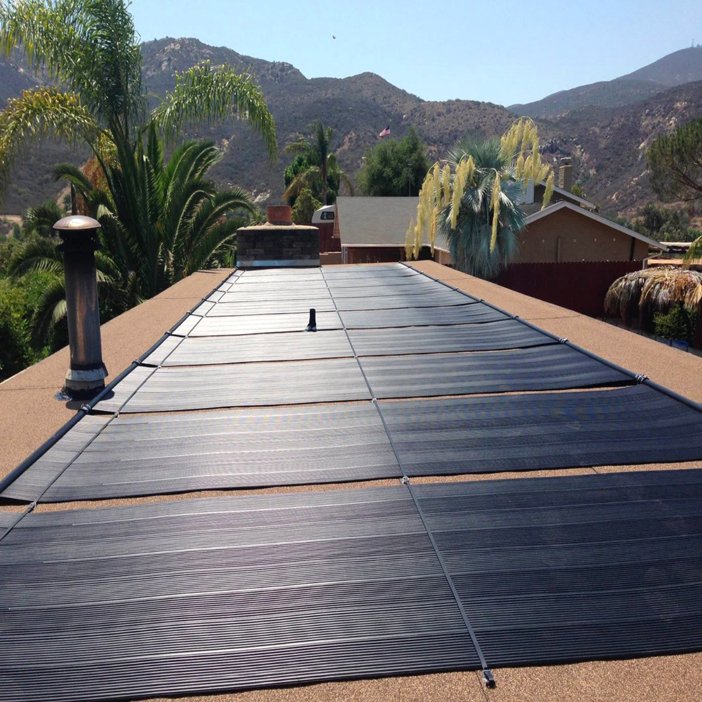 SwimEasy solar pool heating panels installed on a residential rooftop